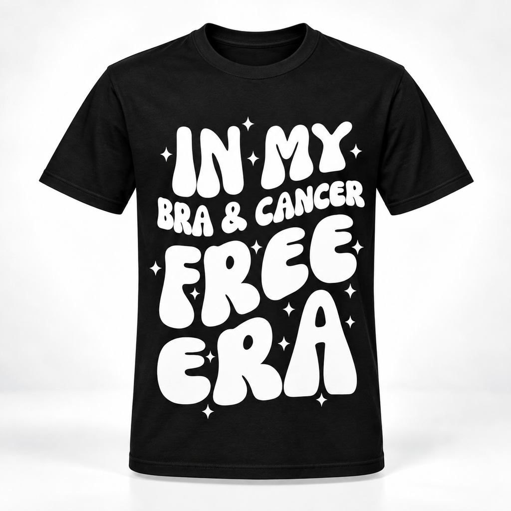 A black short-sleeve crewneck t-shirt with a bold white retro-style graphic reading 'IN MY BRA & CANCER FREE ERA' surrounded by small white star sparkles, shown on a clean white background.