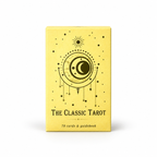 The Classic Tarot deck box in pale yellow with a black celestial design of a crescent moon, sun, and stars, on a white background.