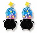 A pair of dangle earrings featuring black glitter cauldron charms and holographic blue, pink, and yellow star-shaped charms on silver posts with yellow star studs, shown against a plain white background.