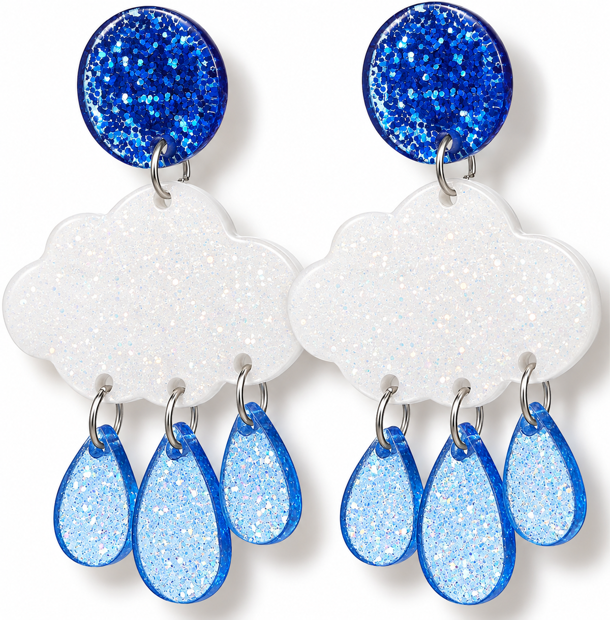 A pair of dangling earrings with blue glitter round studs, white glitter cloud-shaped drops, and light blue glitter teardrop charms on silver hooks, shown on a white background.