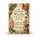 The Green Witch's Oracle Deck box shown upright on a plain white background. The front features whimsical illustrated botanical and natural magic motifs, including a butterfly, flowers, mushrooms, crystals, and a cauldron, with the title in large black text.