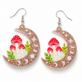 Mushroom Moon Earrings with wooden crescent moons, red toadstool mushrooms, green leaves and celestial details