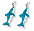 A pair of shark-shaped drop earrings with a textured turquoise blue and white enamel design, attached to silver stud posts on a white background.