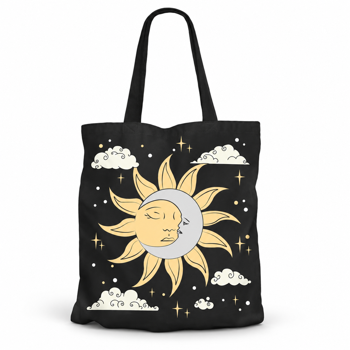A black canvas tote bag featuring a celestial graphic of a sleeping sun and moon, white clouds, and gold stars on a clean white background.