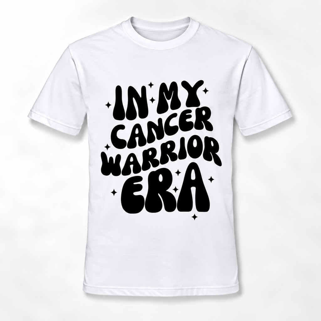 A white short-sleeve crewneck t-shirt with a bold black retro-style graphic on the front that reads 'IN MY CANCER WARRIOR ERA' surrounded by small star accents.