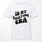 A white short-sleeve crewneck t-shirt with a bold black graphic text reading 'IN MY FIGHTING ERA' decorated with small star accents, displayed on a clean white background.